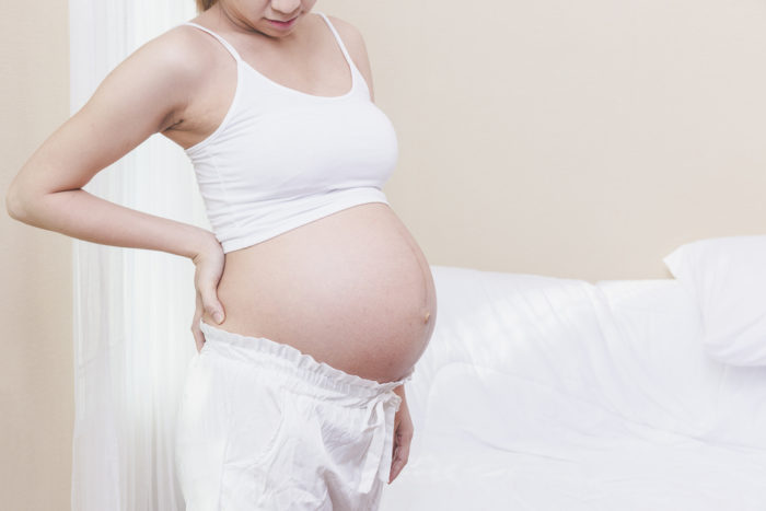 ryggsmärta under graviditeten med hjälp av värmepanna